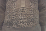 Closeup of the bottom portion of the calado hand embroidery on the piña silk Mark Barong Tagalog