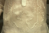 Closeup photo of the bottom of the calado hand embroidery on the cocoon Ryan Barong Tagalog. Ryan wears a chamisa de chino underneath his barong.