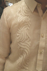 Right shoulder and upper chest portion of hand embroidered piña silk Blase Barong Tagalog with button placket, right side of collar and right sleeve showing