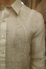 Closer look at the left shoulder and upper chest portion of the hand embroidered piña silk Chris M Barong Tagalog. Also shown is the button plackets and left sleeve