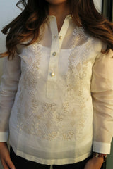 Product shot of the hand embroidered jusi Krizia Barong Tagalog. Krizia's hair covers parts of the top of the barong