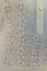Closeup of the bottom left corner of the calado hand embroidery of the piña silk Michelle Barong Tagalog