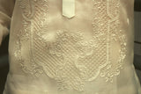 Closeup photo of the bottom of the calado hand embroidery on the cocoon Ryan Barong Tagalog. Ryan wears a chamisa de chino underneath his barong. 